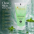 Cosmeticcka Advanced Pure Skin Gel Face Wash in a translucent light green squeeze tube, displayed on a reflective surface with water splashes, mint leaves, and glass blocks. The left side features marketing text and icons detailing skin benefits.