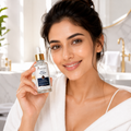 A woman in a white robe holds up a bottle of Dr. Sathya Skin & Anti-Aging Serum in front of a bright bathroom background.